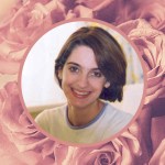 A portrait shot of Emily Collingridge, smiling at the camera. The image is on a background of pink roses
